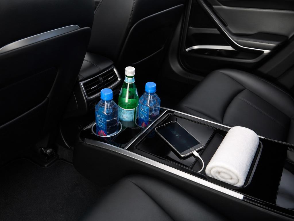 Rear console with refreshments and wireless charging
